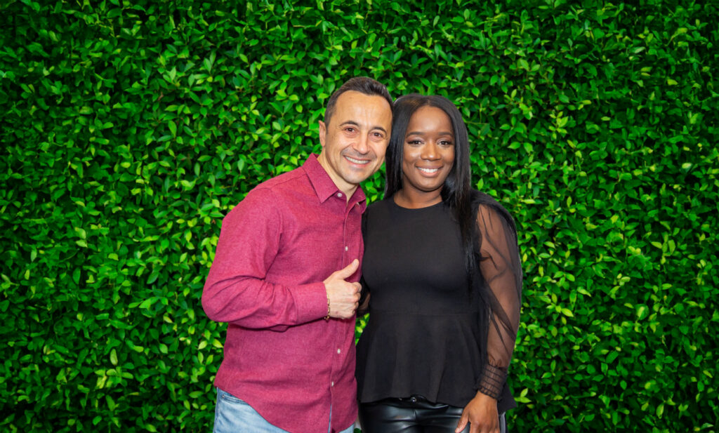 Dr Gen And Patient Smailing In Front Of An Ivy Wall