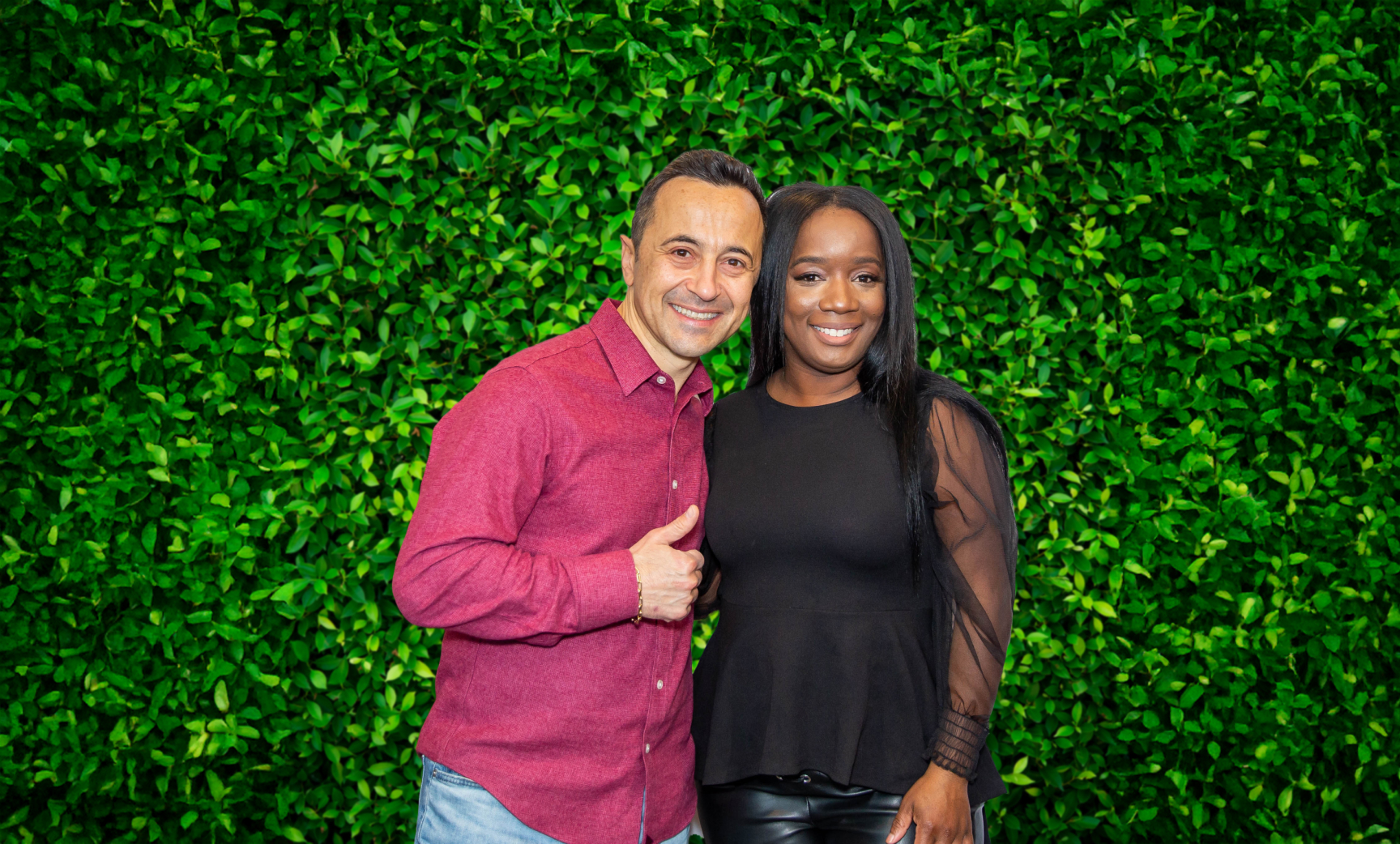 Dr Gen And Patient Smailing In Front Of An Ivy Wall