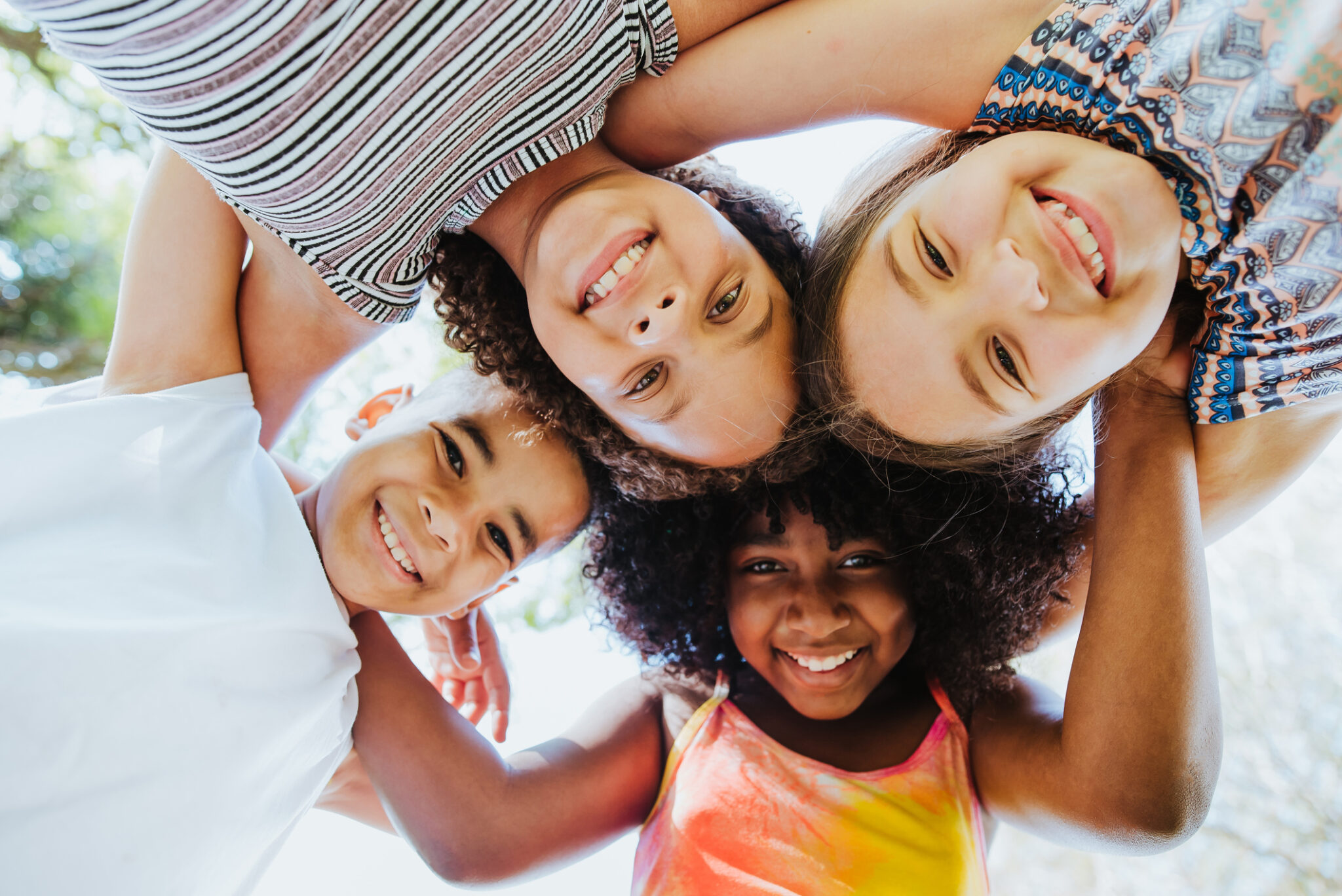 Group of children smiling and looking at the camera