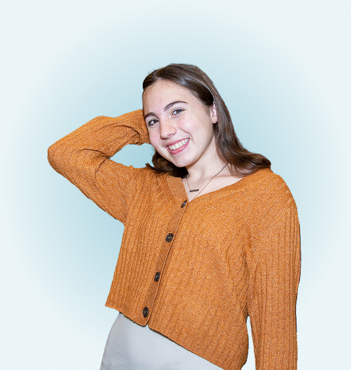 portrait of a female in an orage sweater