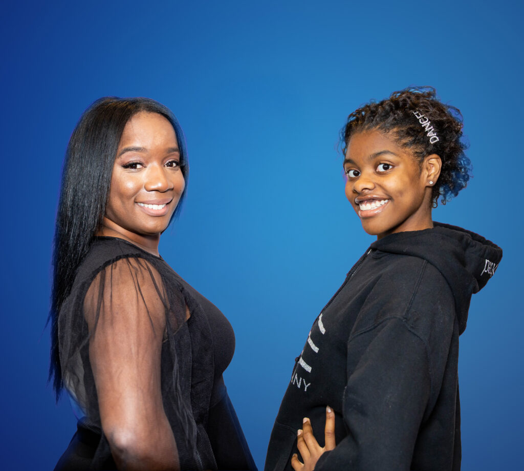 Two Beautiful Girls Smiling At The Camera