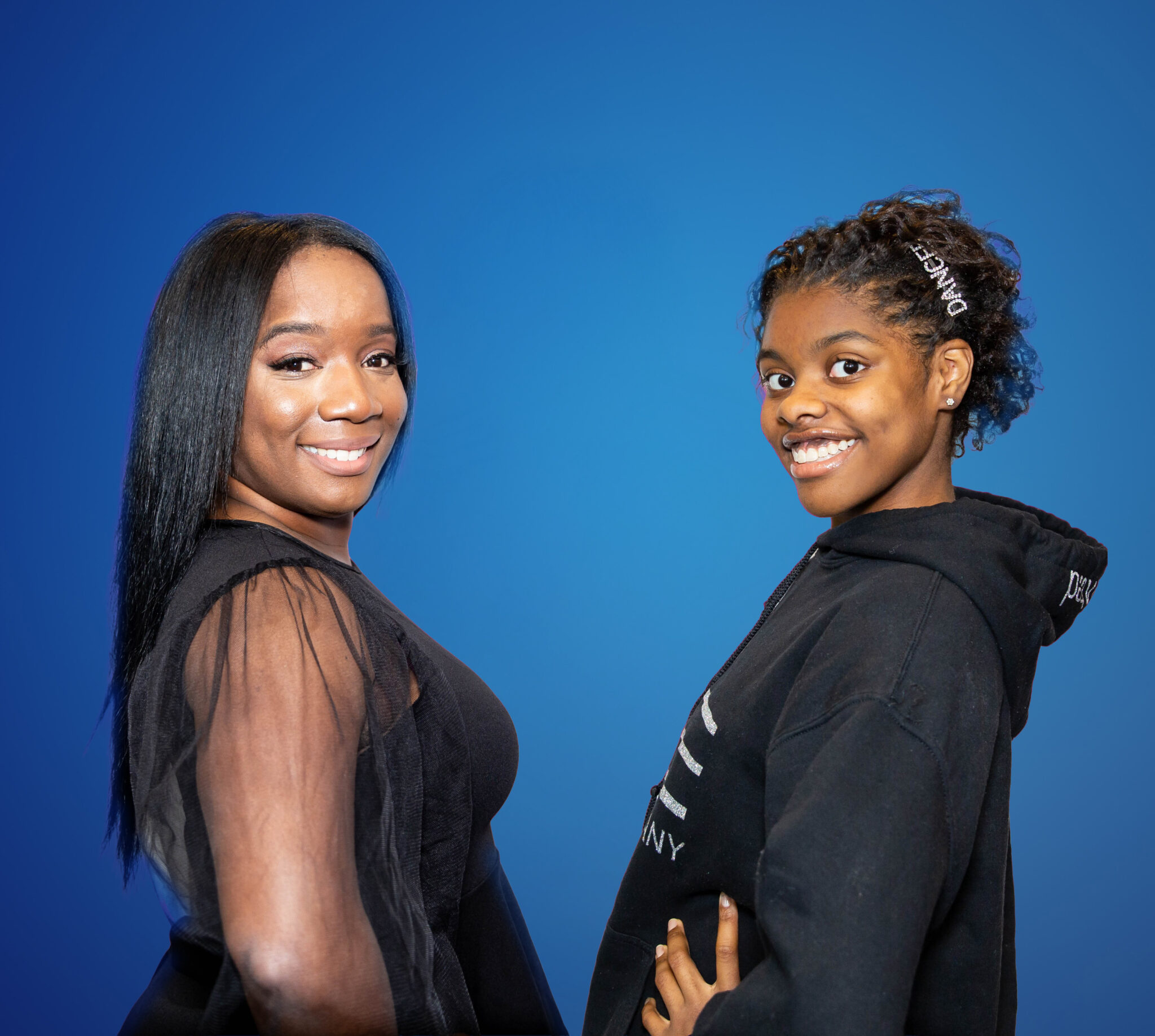 Two Beautiful Girls Smiling At The Camera